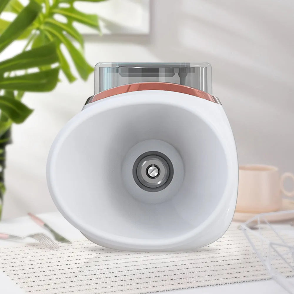White and purple portable eye humidifier with USB charging cable on a desk