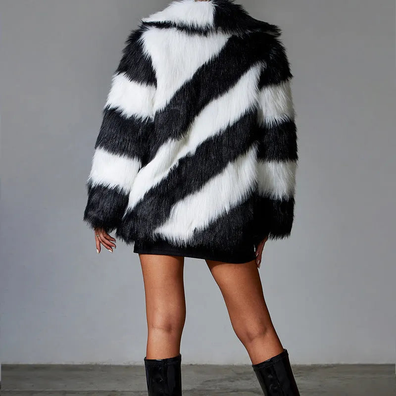 Women's faux fur coat with a contrasting colour lapel and a large fur collar.