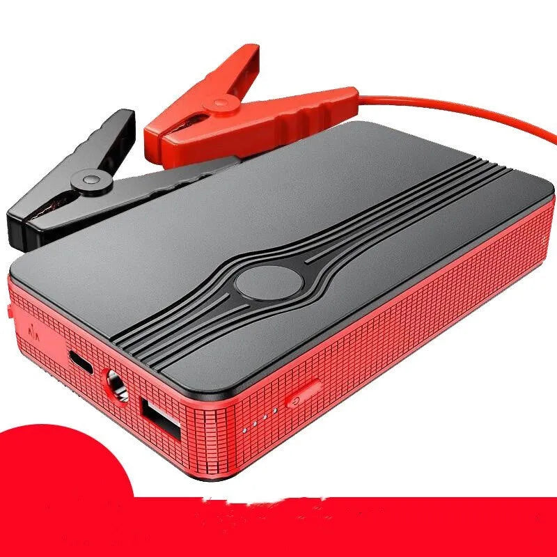 Red K4-E automobile emergency starting power supply unit with display, shown next to its included data cable.