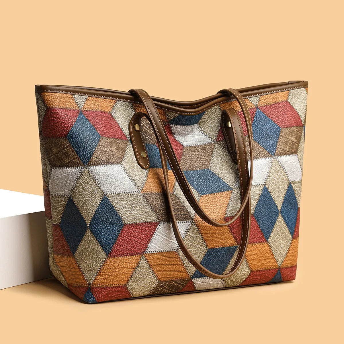 Women's blue brown PVC shoulder handbag with sandwich pocket design showing organised compartments