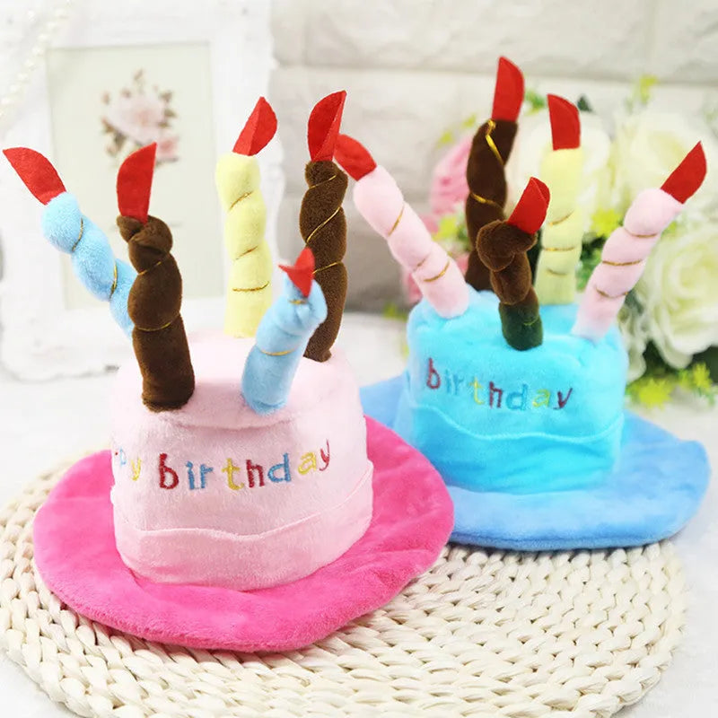 Blue felt dog birthday hat with elastic band shown on small dog for size reference