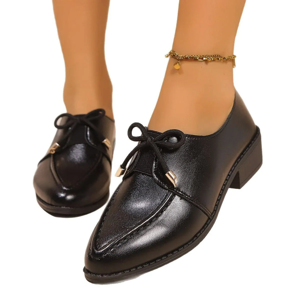 Women's flat shoes with a pointed toe and a choice of bow or buckle detail on the upper.