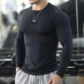 Men's black fitness tights with long sleeves and slim fit design for athletic activities
