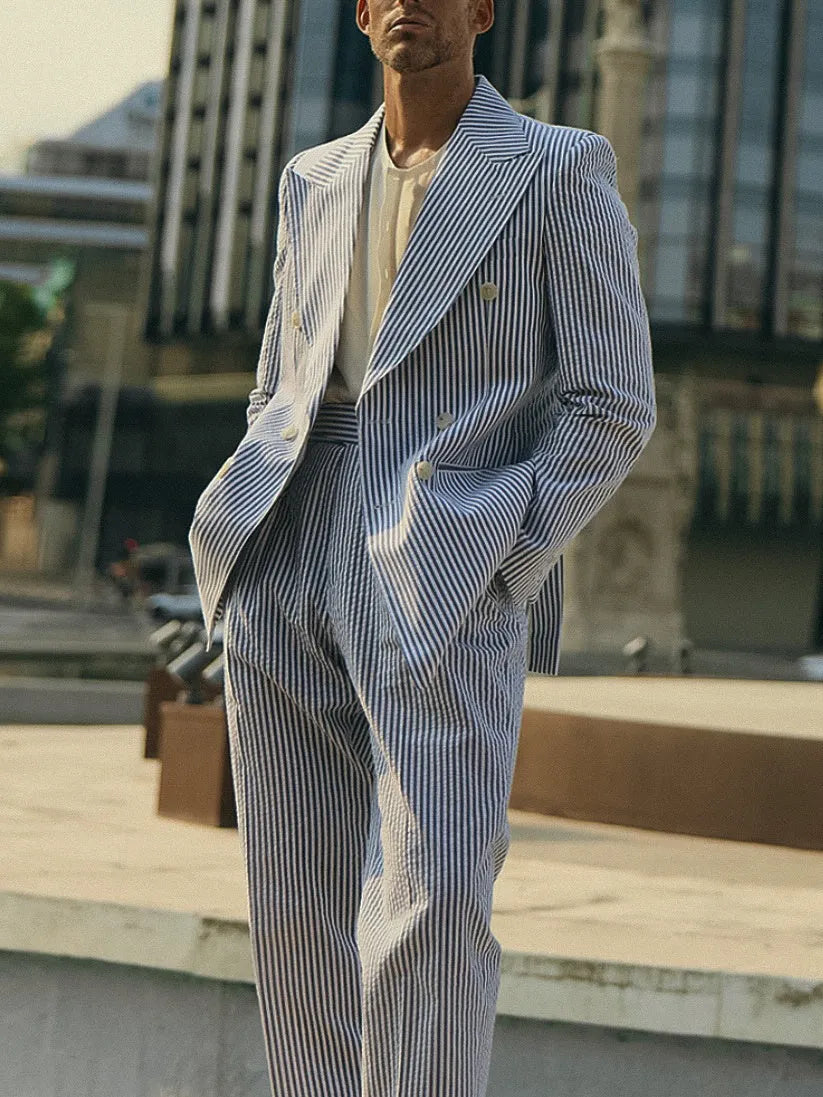 Women's blue and white striped polyester suit set with long-line blazer and matching trousers