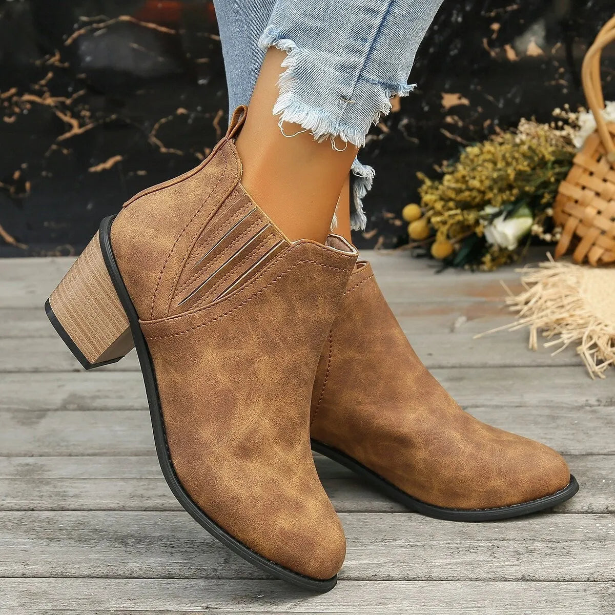 Women's black ankle boots with pointed toe, thick square heel and slip-on design
