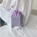 Small women's chain messenger bag in bucket style with zip opening