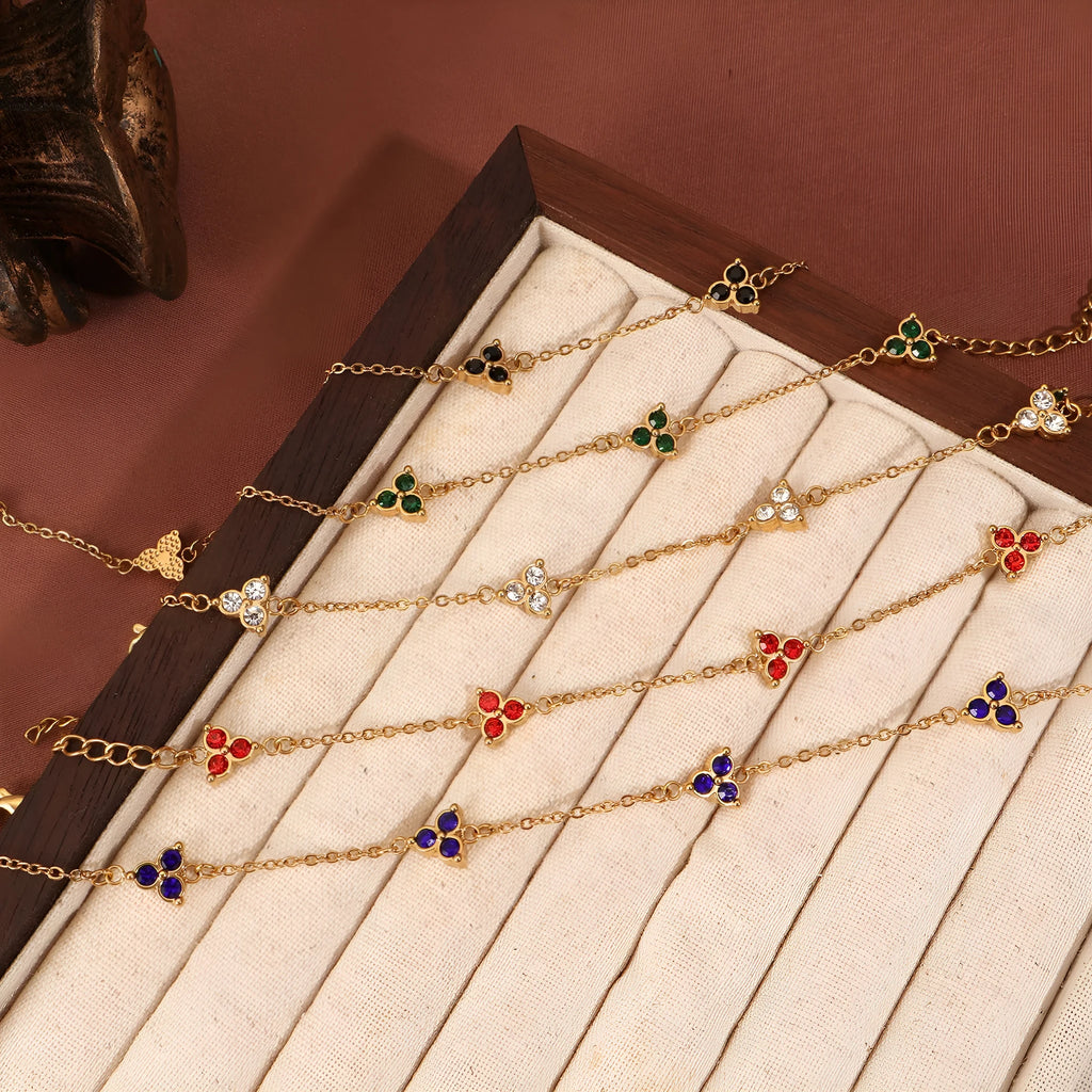 Stainless steel women's bracelet with three triangular zircon stones in a choice of colours and metal finishes.