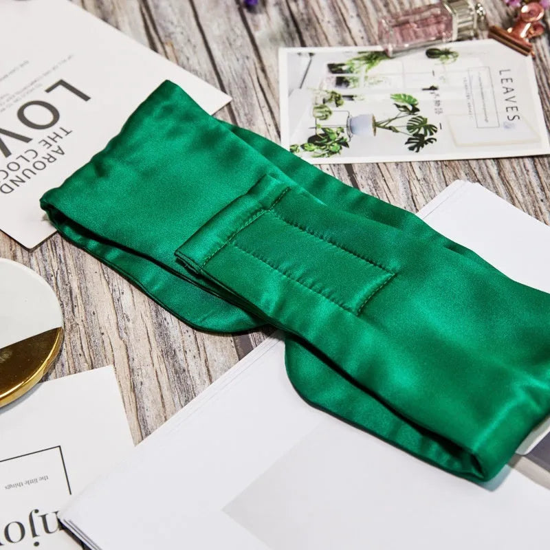 Mulberry silk sleep eye mask shown in one of seven colours: black, champagne gold, green, navy, pink, silver grey, or white.