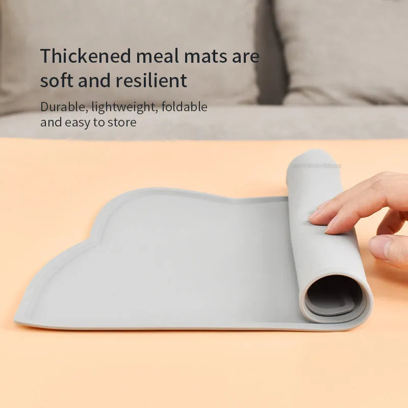 Waterproof silicone pet feeding mat in grey, cat head shape, 44x24cm, with a pet bowl on top