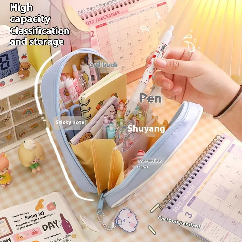 Transparent PVC pencil case with cartoon designs measuring 22cm length for school stationery organisation