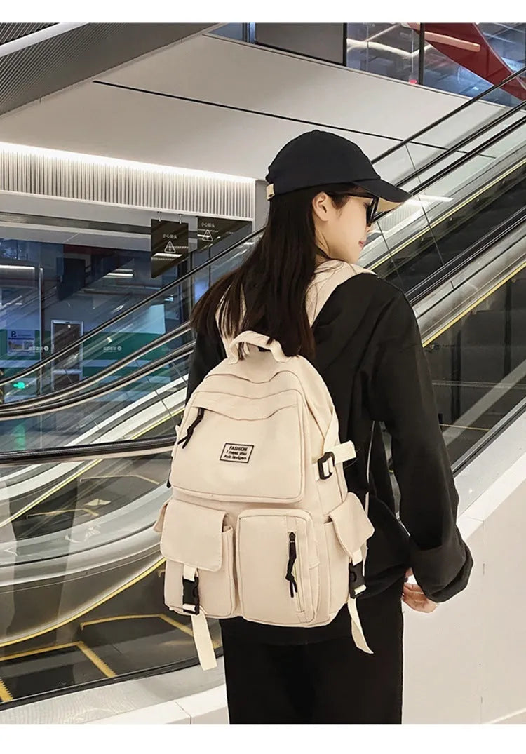 Soft nylon student backpack in black with a three-dimensional front pocket.