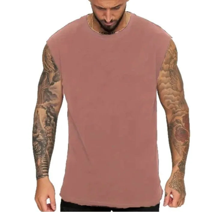 A man's loose grey cotton sleeveless t-shirt on a hanger, showing the straight hem and pullover design.