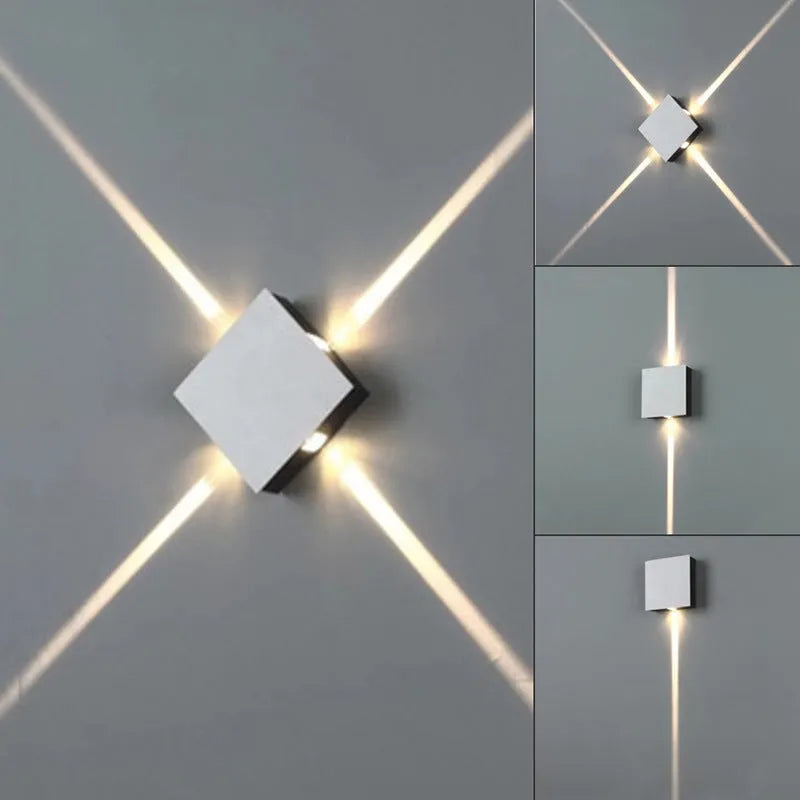 Modern square aluminium and iron LED wall light with warm white glow on a wall