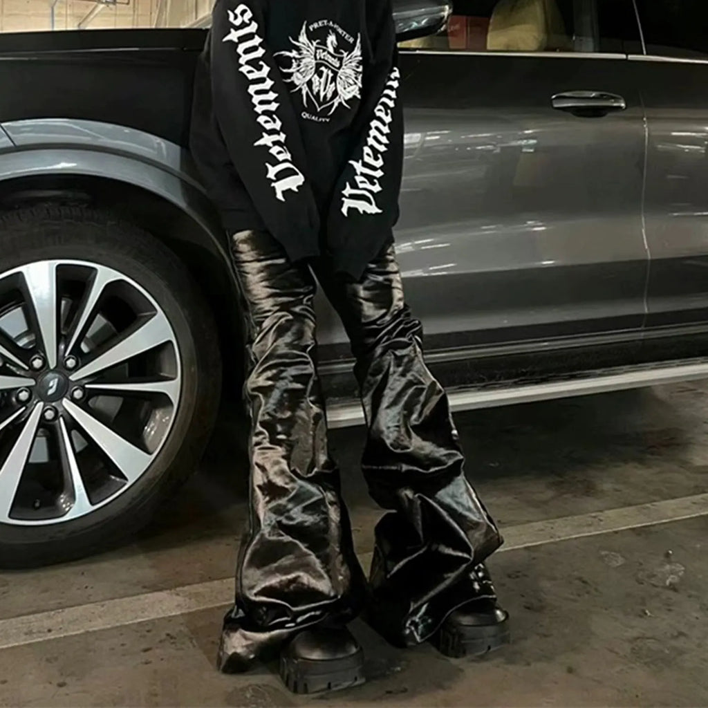 Black shiny patent leather skinny jeans for women in a straight-leg style.