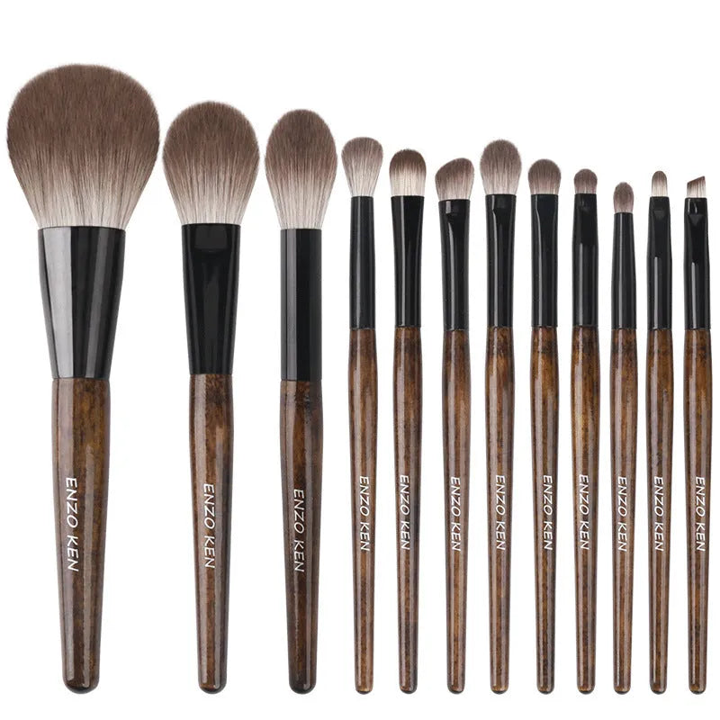 12-piece makeup brush set with wooden handles in a black PU zip-up case.