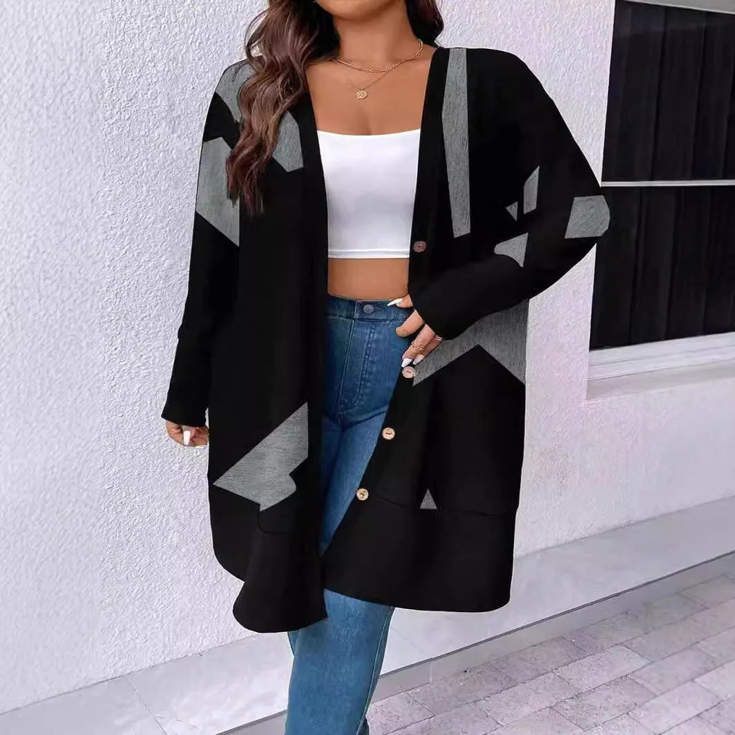 Black loose fit plus size knit cardigan with button detail on a hanger.