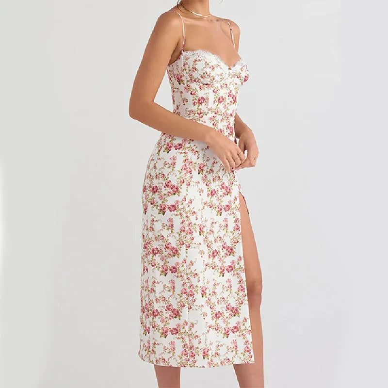 Women's long dress with lace flower print, high split, and suspender straps in blue colour.