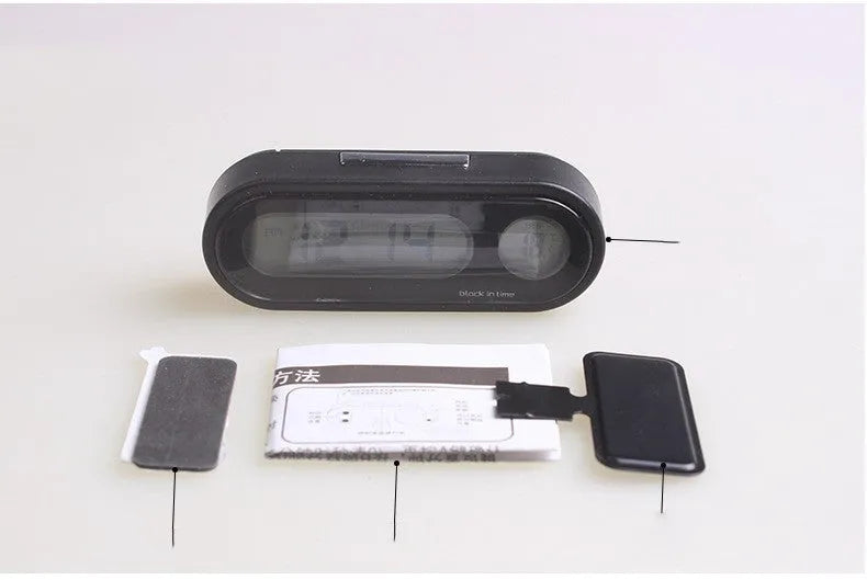Black electronic car clock thermometer with luminous LED display showing time and temperature