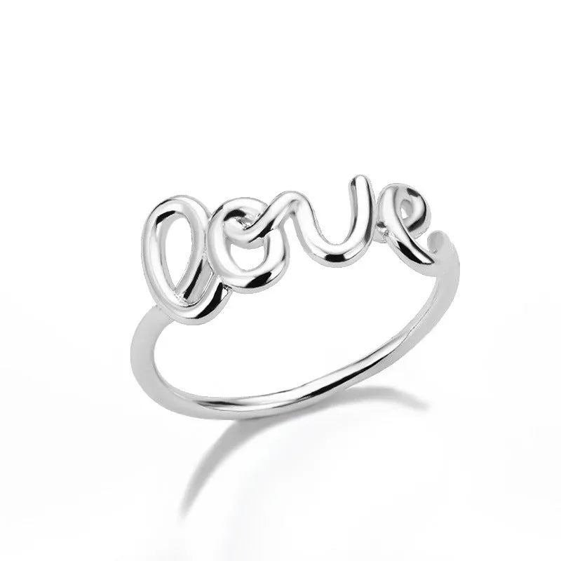 Small unisex copper LOVE ring with engraved text in gold finish for couples