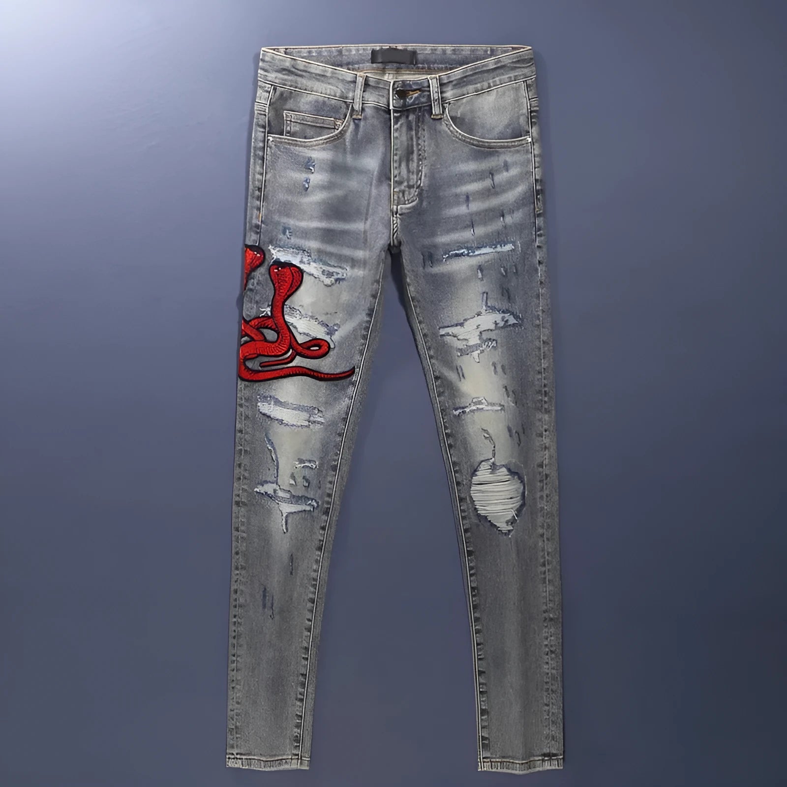 Old colour slim fit jeans with washed-out finish and embroidered hole patches