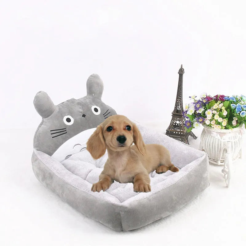 Cartoon-style plush pet sofa bed for small dogs and cats with a washable cover.