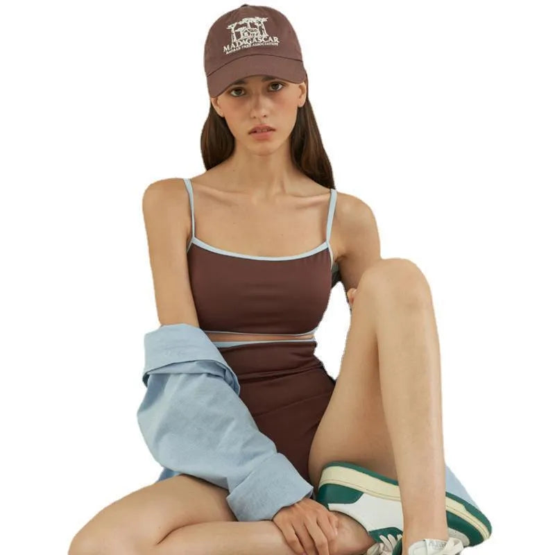 Brown women's one-piece swimsuit with triangle bust style on a mannequin.