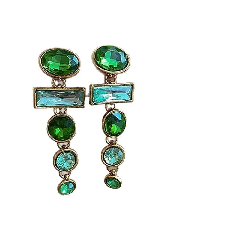 A pair of retro green gradient alloy earrings with geometric shapes and a long tassel design.