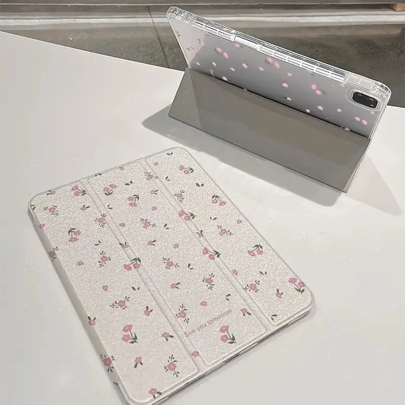 Transparent floral patterned tri-fold iPad case with magnetic stand function showing compatible tablet models
