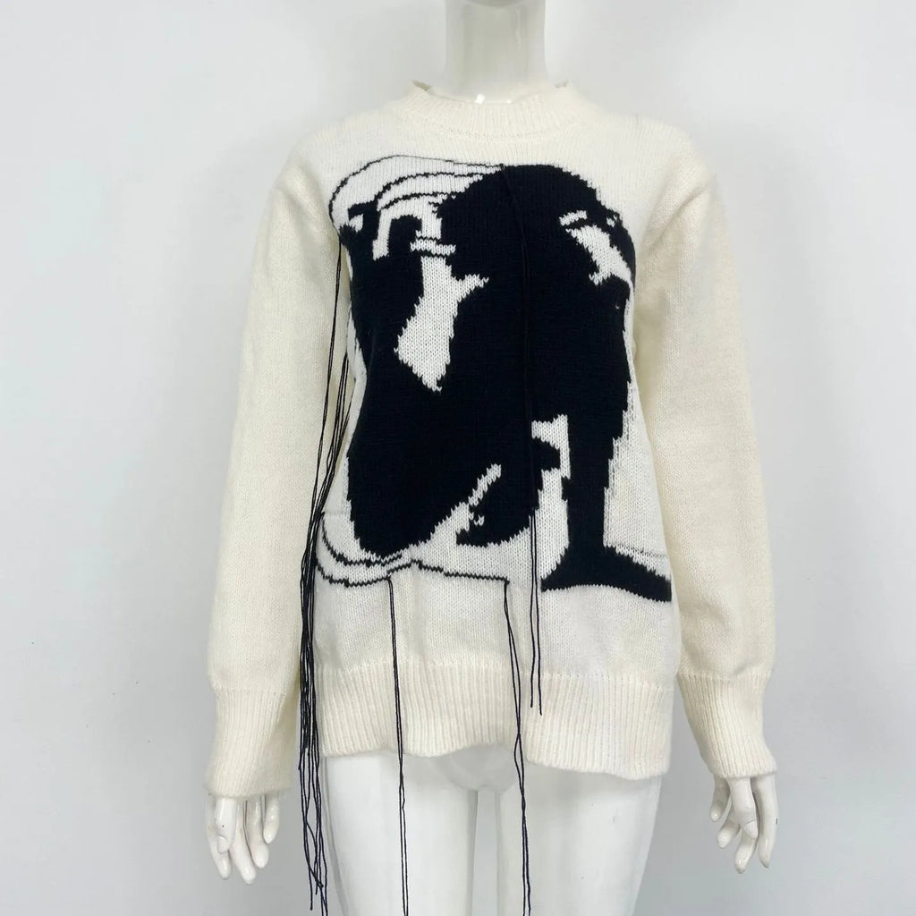 Women's loose alpaca wool tassel sweater in gray, round neck pullover style, side view on model