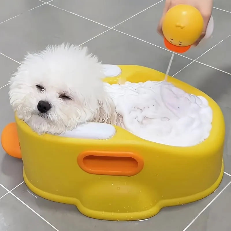 A blue duck-shaped PVC bath tub for washing dogs and cats on a bathroom floor.