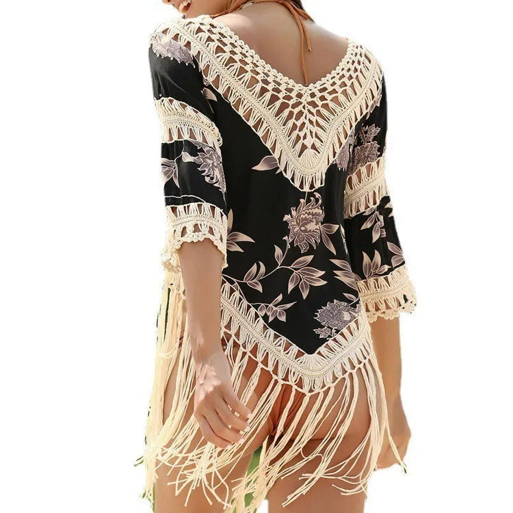 Women's apricot V-neck sun protection blouse with hollow-out sleeves on a beach.