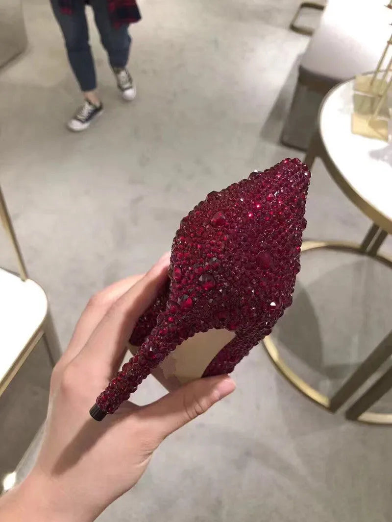 Women's gold stiletto high heels with rhinestone decoration on pointed toe