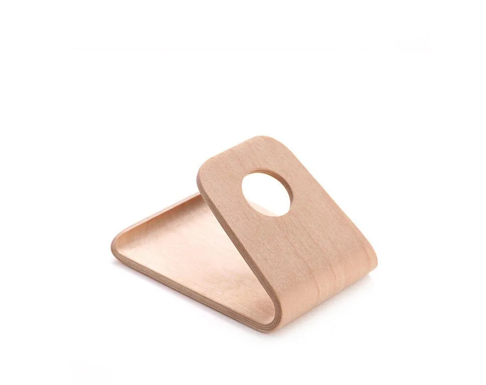 Wooden stand for iPhone in Walnut finish, placed on a desk, holding a phone for hands-free viewing