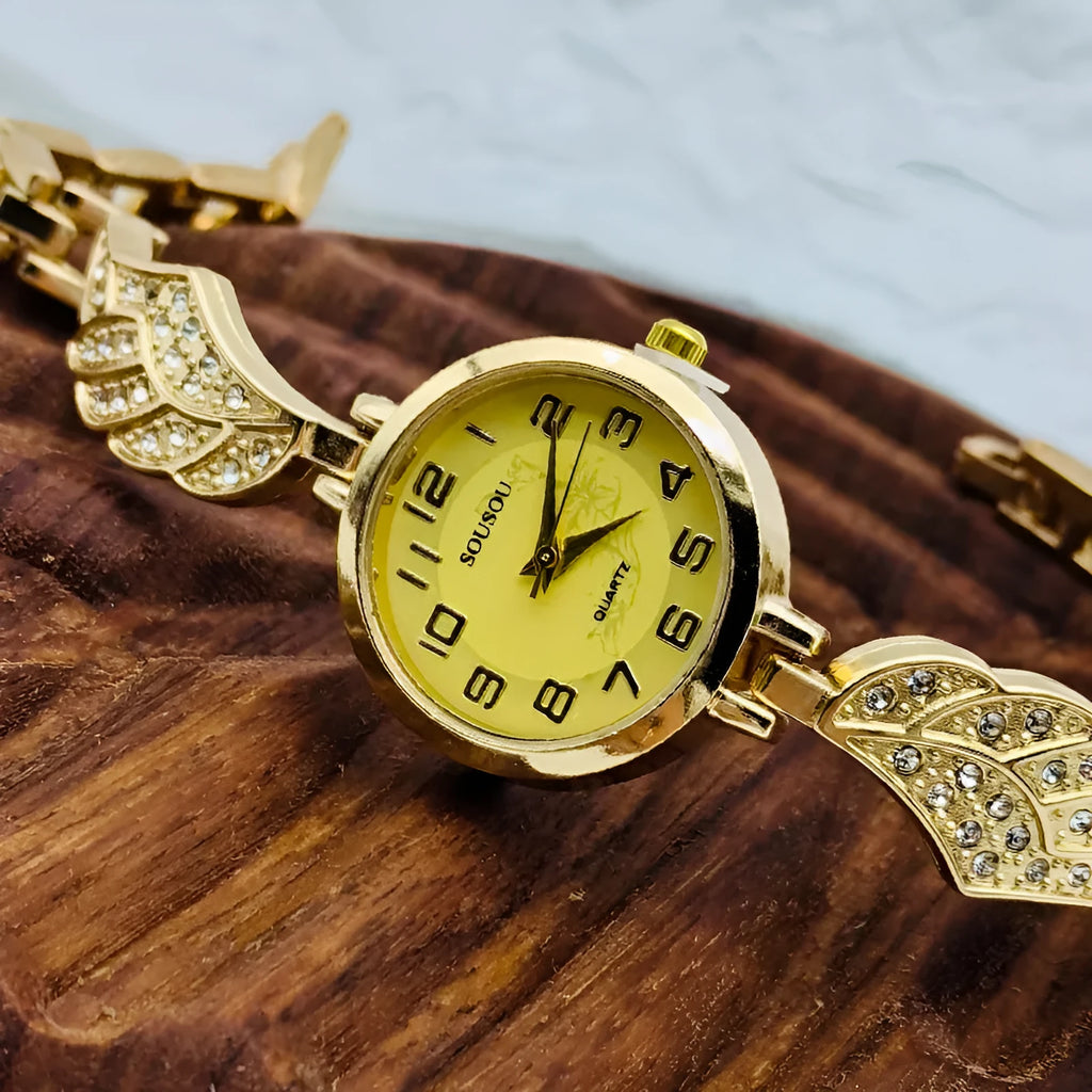 Women's stainless steel watch with round dial and Vachette clasp buckle showing gold face option