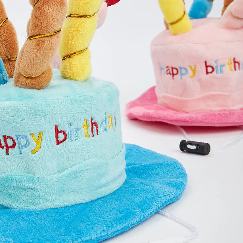 Blue felt dog birthday hat with elastic band shown on small dog for size reference