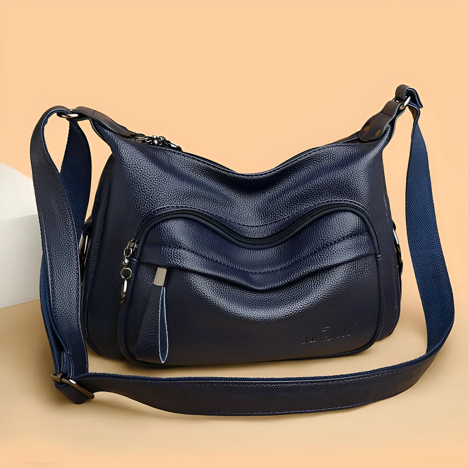 Blue women's large shoulder bag with crossbody strap showing internal mobile phone and certificate pockets