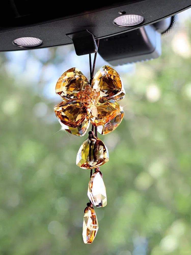 Crystal Four Leaf Grass car pendant decoration in transparent, champagne, black, and shiny finishes, approximately 20 cm long.