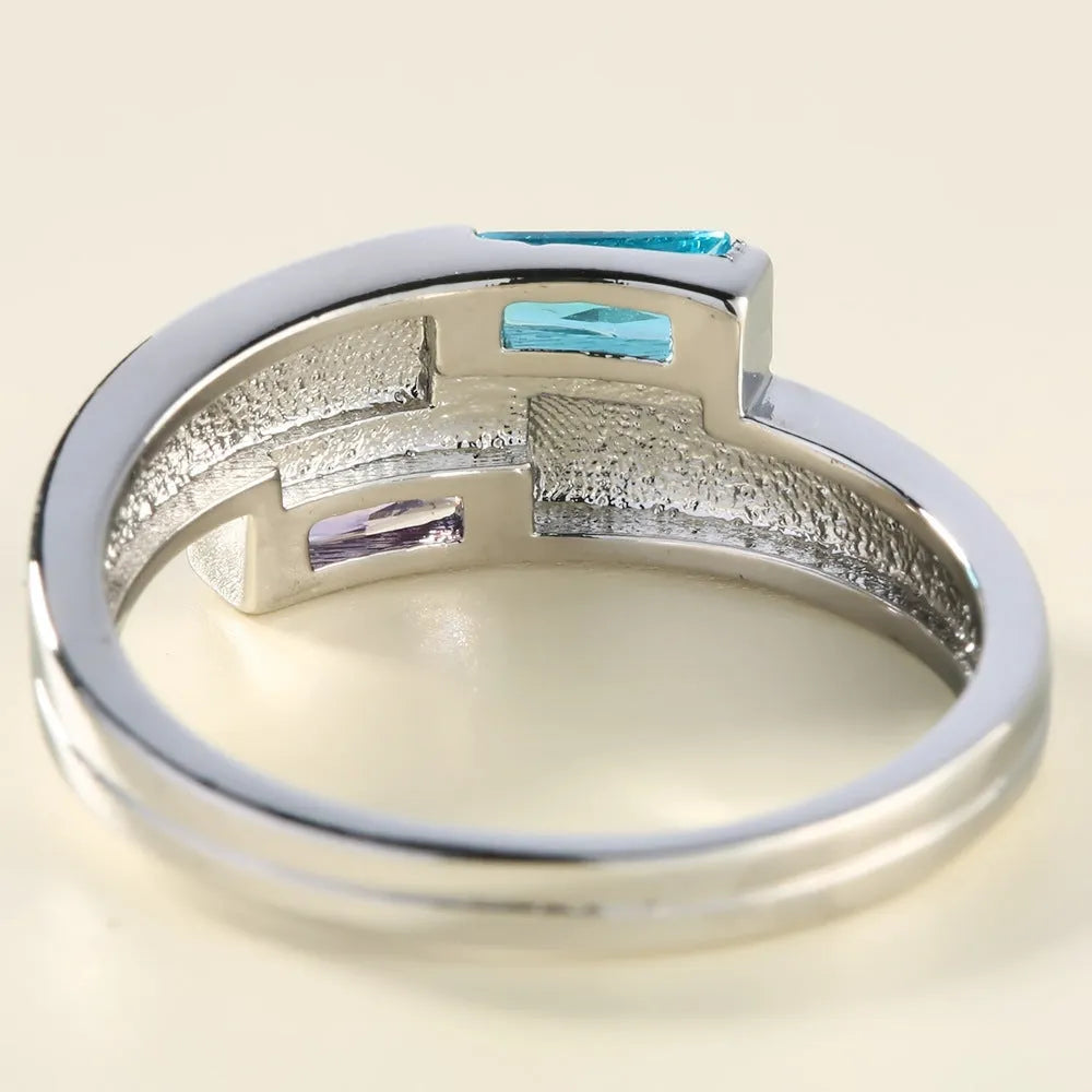 Copper ring with zircon inlay and electroplated silver finish in European-American geometric style.