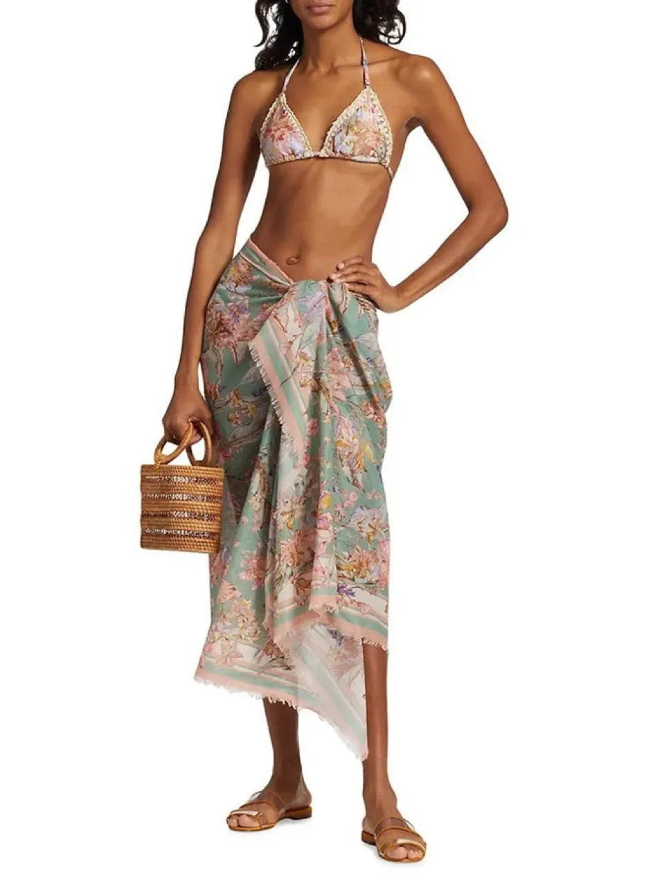 Women's creamy-white floral bikini set with halter top, briefs, and skirt