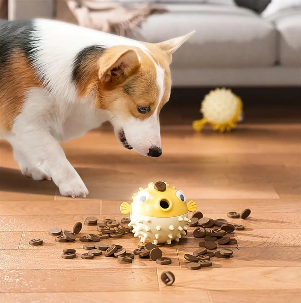 Green fish-shaped interactive dog toy with textured surface for treat dispensing and dental cleaning