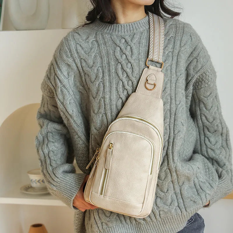 Women's small chest messenger bag in soft PU leather with open pocket and sewing thread detailing