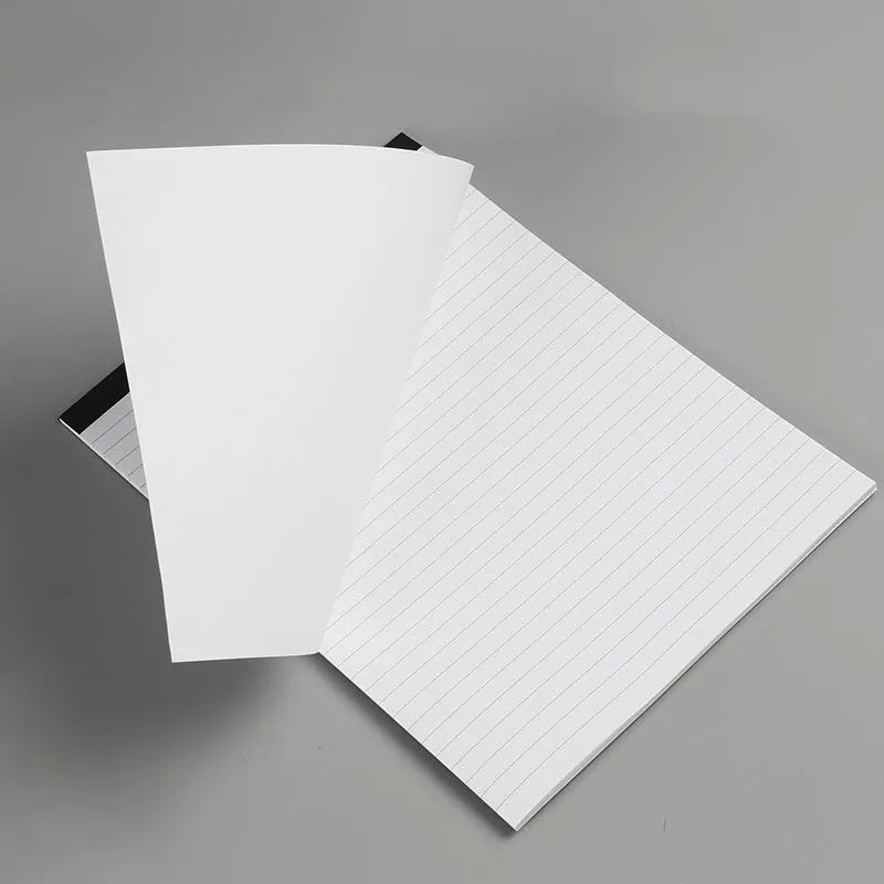 A4 tearable notebook with grid paper and a paper cover, shown open to reveal its pages.
