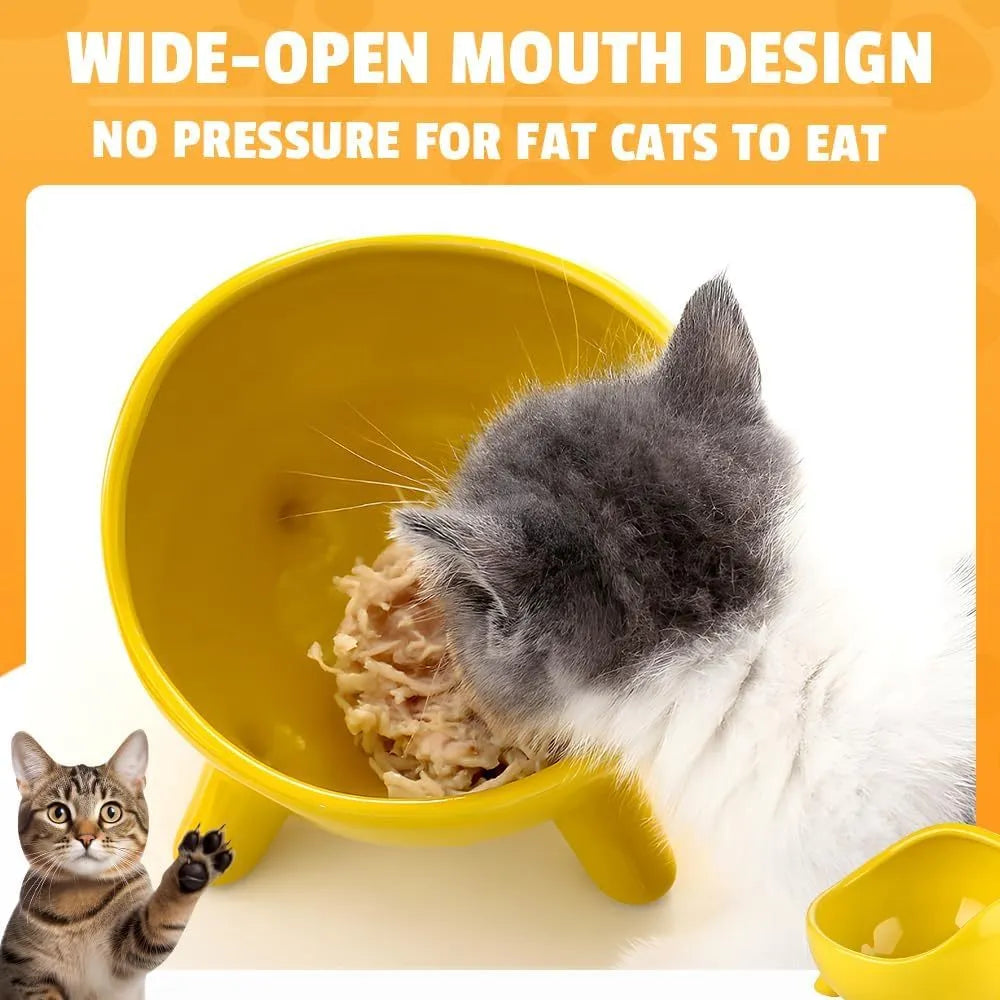 Green ceramic cat food bowl with four legs, wide mouth, and rounded arc shape on a light floor