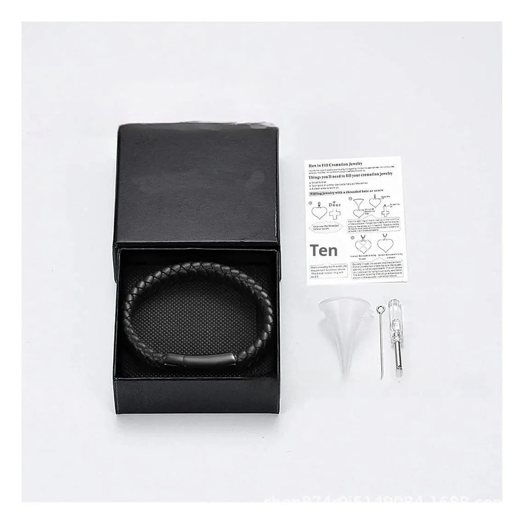 Black stainless steel memorial bracelet with woven leather detailing, showing personalisation engraving area.