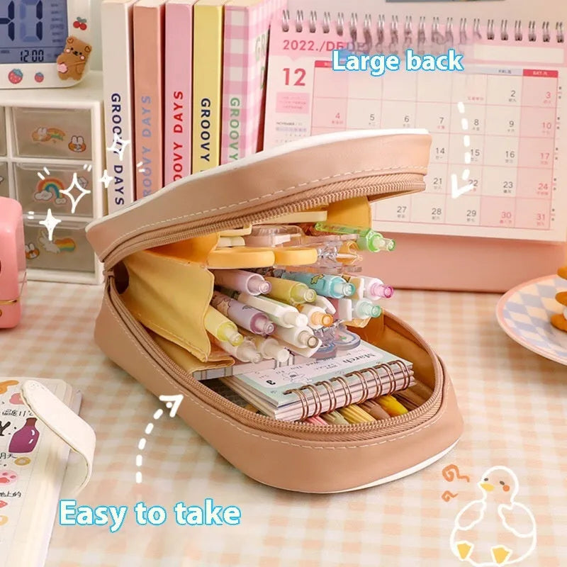 Transparent PVC pencil case with cartoon designs measuring 22cm length for school stationery organisation