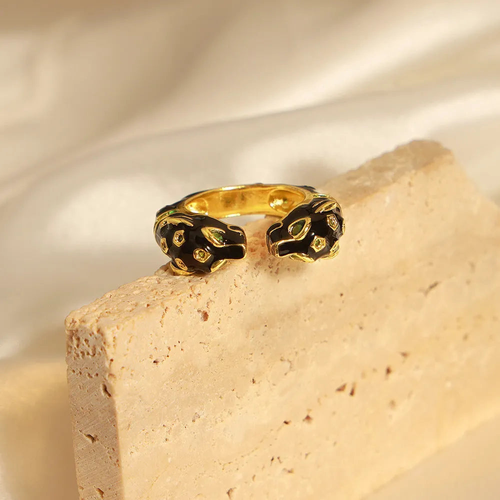 Black cheetah pattern open ring with geometric design on copper base