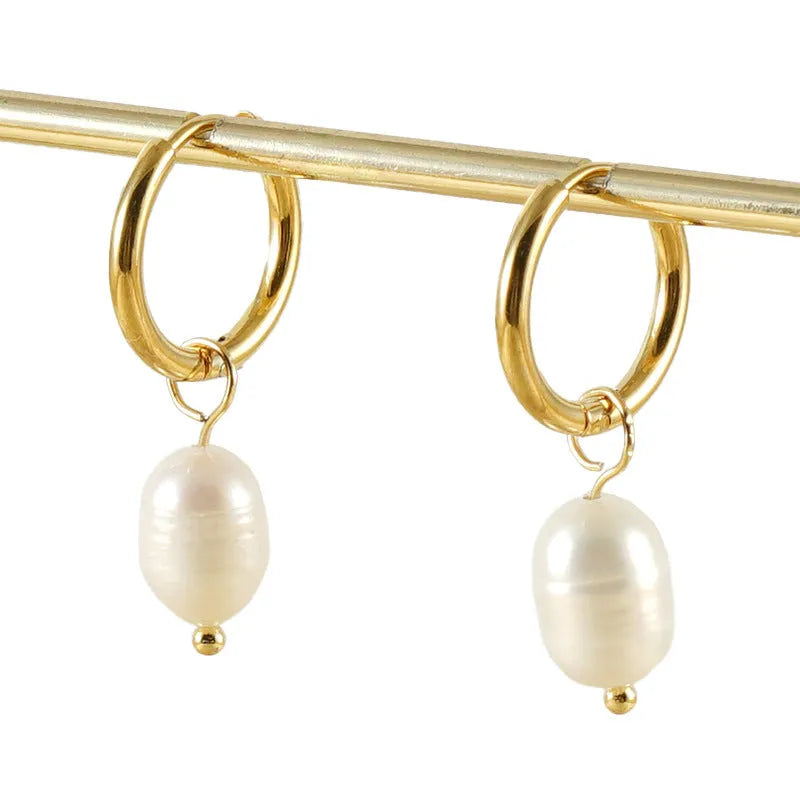 Gold geometric women's earrings with a central pearl, made from stainless steel and titanium steel.