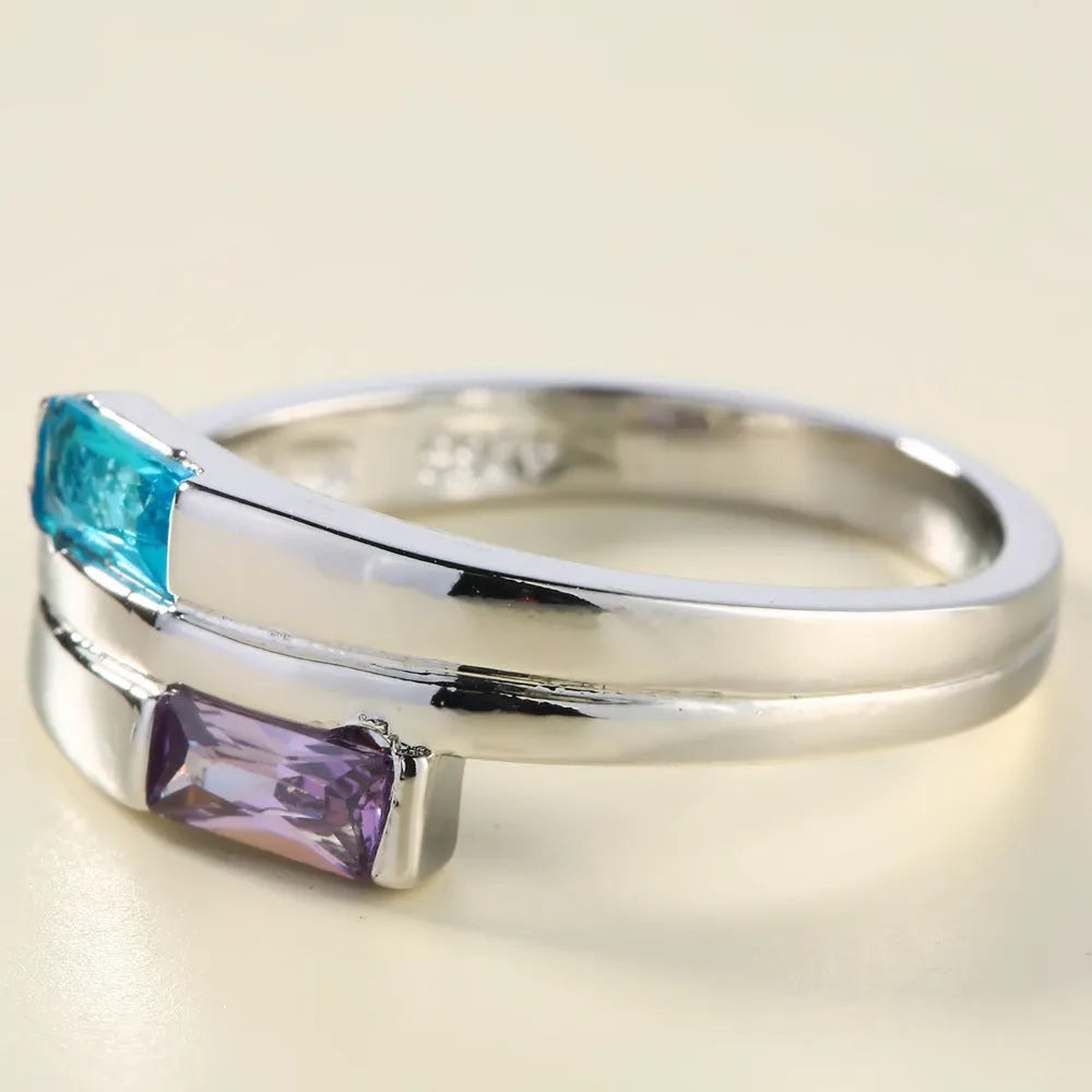 Copper ring with zircon inlay and electroplated silver finish in European-American geometric style.