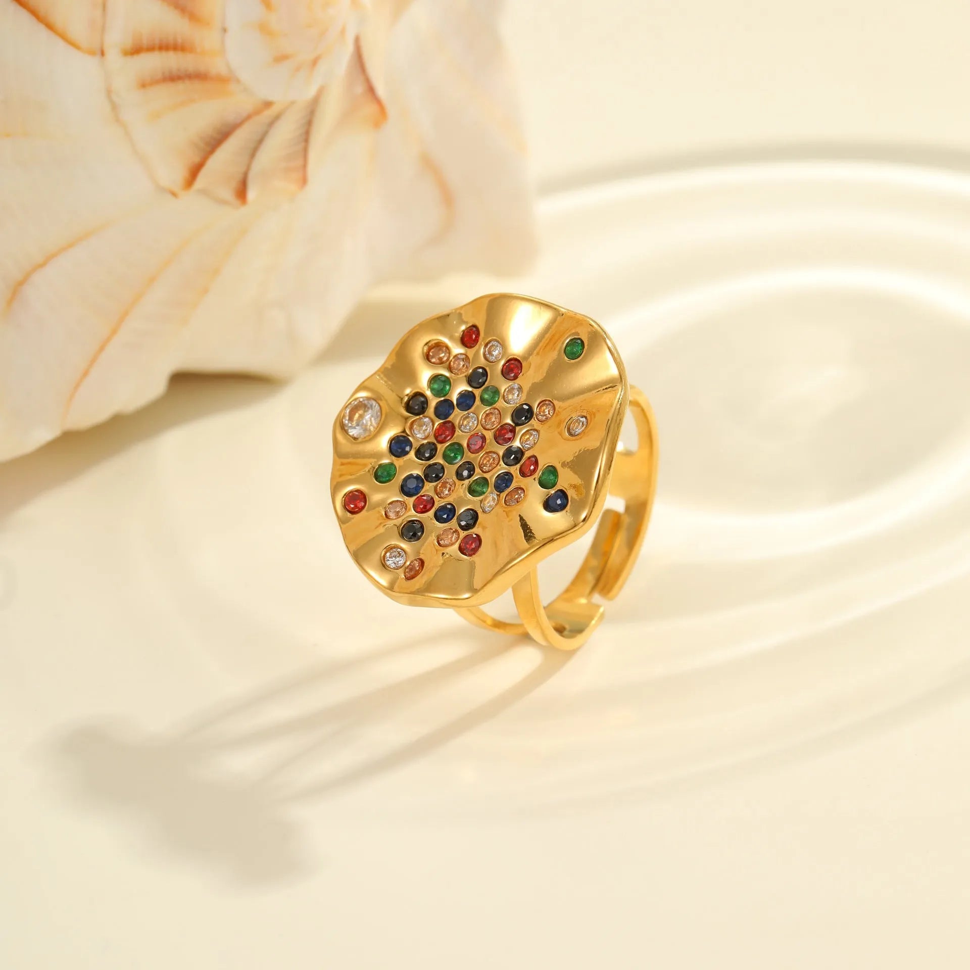 Adjustable geometry ring with pleated diamond pattern on stainless steel