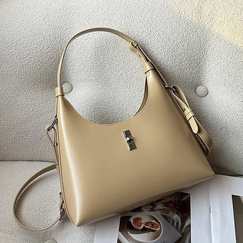 Soft brown genuine leather dumpling-shaped crossbody bag with a front sandwich pocket.